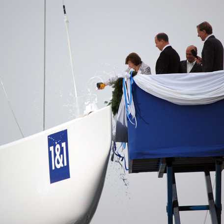 Photo showing the final baptism with a champagne bottle bursting on the hull of Germany I