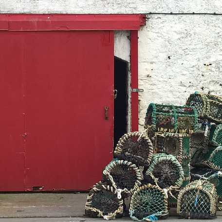 Some crustacean traps outside of a storage facility at Port Askaig on Islay